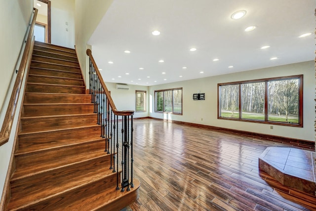 374 Packer Dr, Weatherly, PA 18255 - staircase featuring baseboards, recessed lighting, wood finished floors, and a wall mounted air conditioner