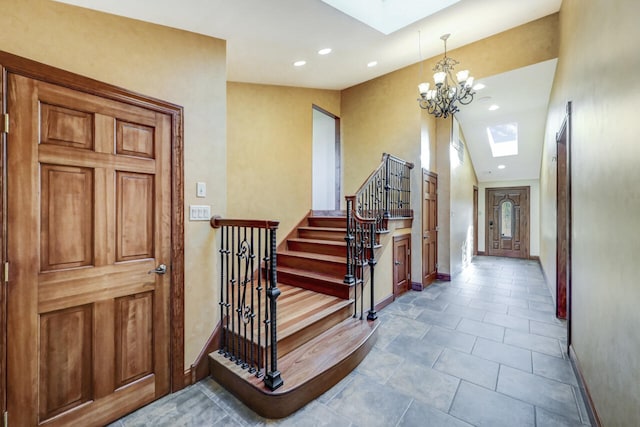 374 Packer Dr, Weatherly, PA 18255 - interior space with a skylight, an inviting chandelier, baseboards, and stairs
