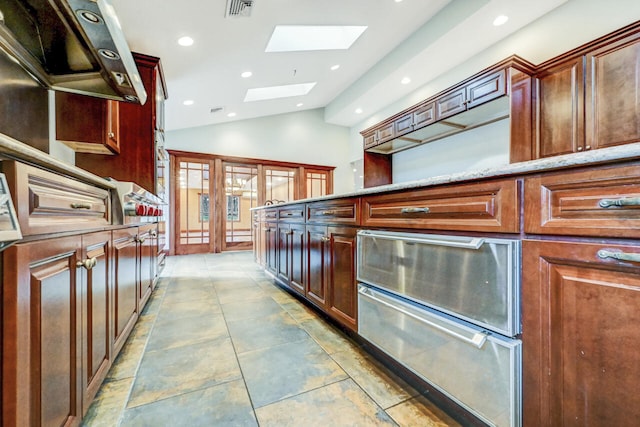 374 Packer Dr, Weatherly, PA 18255 - kitchen with light stone countertops, recessed lighting, visible vents, and lofted ceiling with skylight
