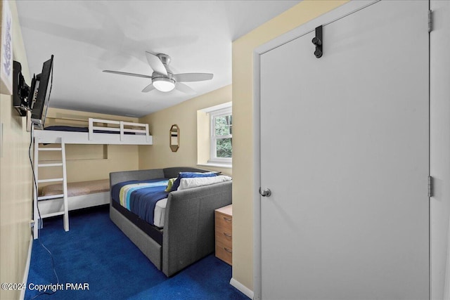 bedroom with ceiling fan and carpet flooring