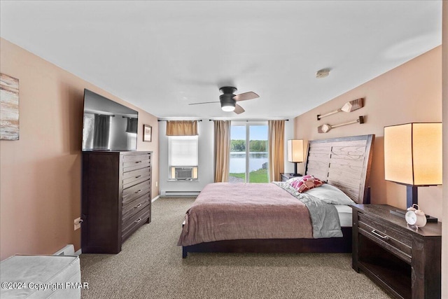 bedroom featuring a baseboard heating unit, cooling unit, light colored carpet, and a ceiling fan