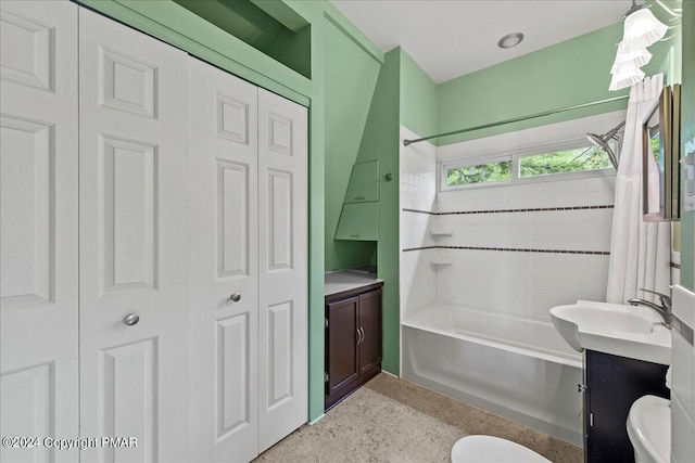 bathroom featuring vanity, a closet, shower / tub combination, and toilet