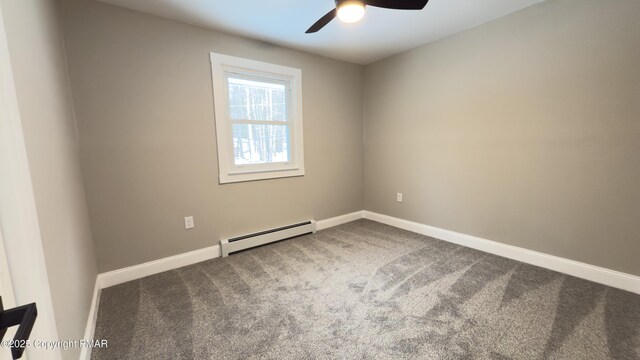 unfurnished dining area featuring dark wood-type flooring, a baseboard radiator, a fireplace, and a notable chandelier