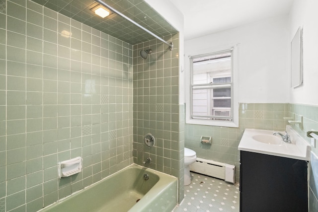 69 Hutson St, Wilkes Barre, PA 18702 - full bath with a baseboard heating unit, vanity, toilet,  shower combination, and tile walls