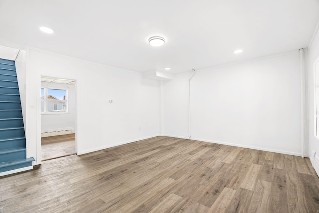 69 Hutson St, Wilkes Barre, PA 18702 - unfurnished room with a baseboard radiator, stairway, wood finished floors, ornamental molding, and recessed lighting