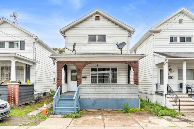 69 Hutson St, Wilkes Barre, PA 18702 - shotgun-style home featuring a porch