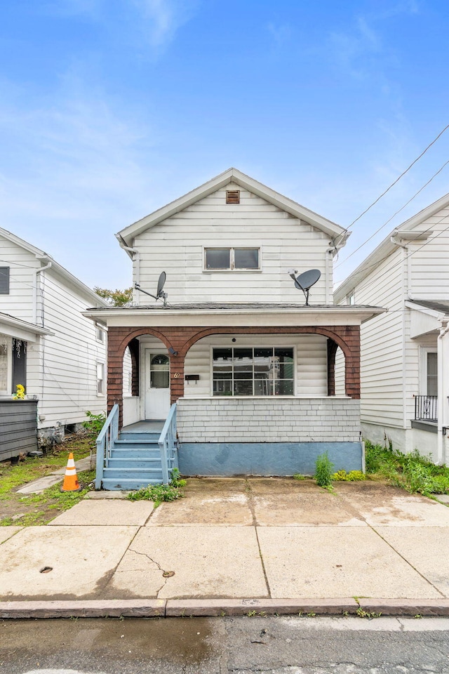 69 Hutson St, Wilkes Barre, PA 18702 - view of front facade with a porch