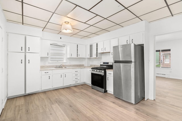 69 Hutson St, Wilkes Barre, PA 18702 - kitchen with stainless steel appliances, a sink, light countertops, and light wood finished floors