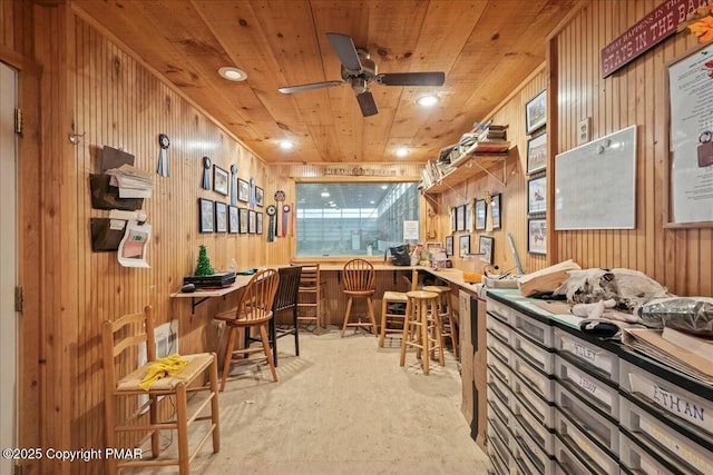 interior space featuring wooden ceiling, ceiling fan, a bar, wood walls, and recessed lighting