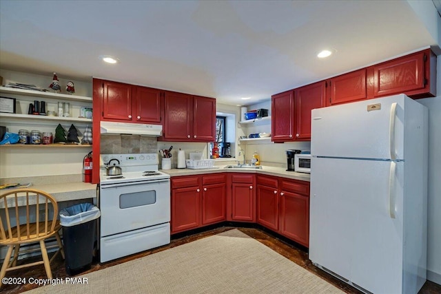 kitchen with under cabinet range hood, white appliances, dark brown cabinets, light countertops, and open shelves