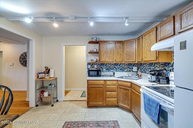 kitchen with open shelves, light countertops, a sink, white appliances, and under cabinet range hood