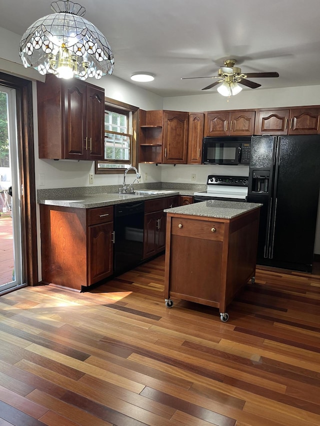 3813 Foxborough Ct, Stroudsburg, PA 18360 - kitchen with black appliances, dark wood-style floors, plenty of natural light, and open shelves