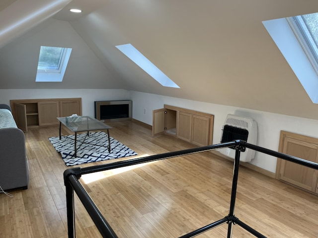 3813 Foxborough Ct, Stroudsburg, PA 18360 - additional living space featuring a skylight, lofted ceiling, light wood finished floors, heating unit, and recessed lighting