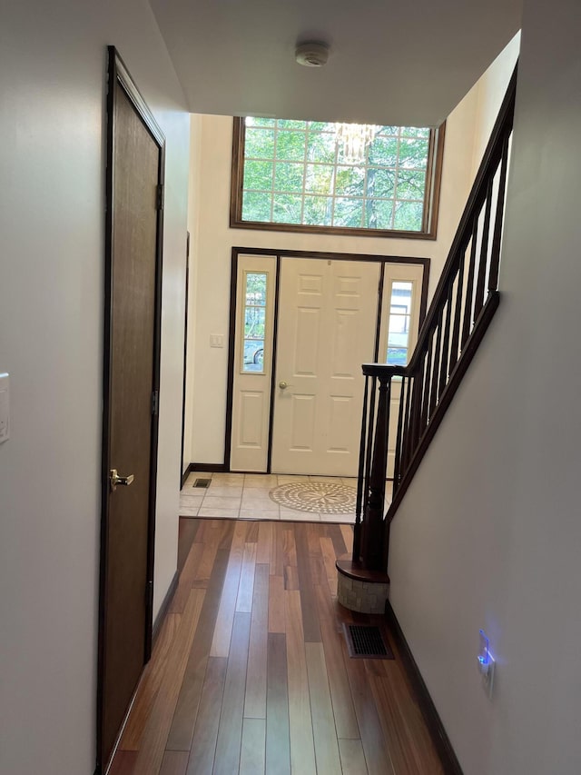 3813 Foxborough Ct, Stroudsburg, PA 18360 - foyer entrance featuring wood finished floors, plenty of natural light, and stairs