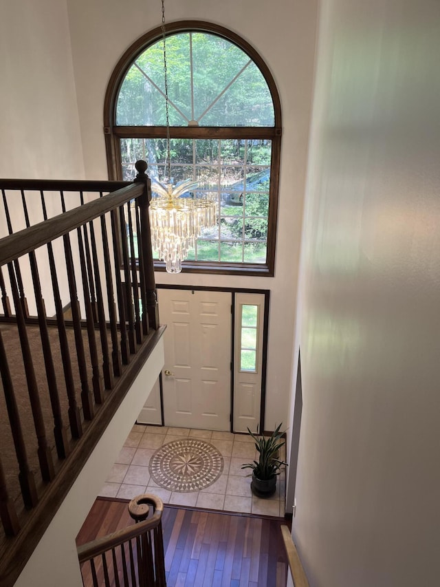 3813 Foxborough Ct, Stroudsburg, PA 18360 - tiled entrance foyer with a chandelier and stairs