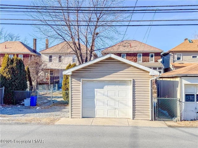 exterior space with an outbuilding and a garage