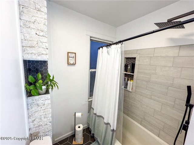 bathroom with tile patterned floors and shower / bath combo