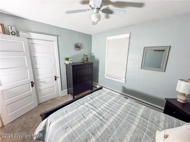 bedroom featuring ceiling fan and carpet