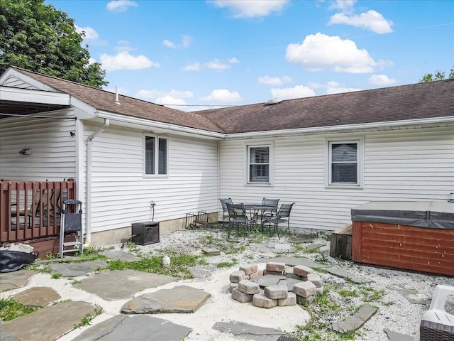 489 Sportsman Club Rd, Nazareth, PA 18064 - back of house with a hot tub, a fire pit, a patio, and roof with shingles
