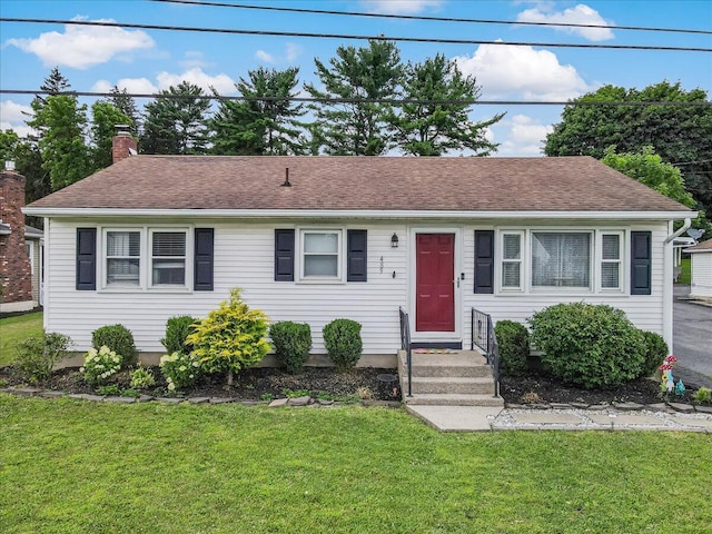 489 Sportsman Club Rd, Nazareth, PA 18064 - view of front of property featuring a front lawn, a chimney, and a shingled roof