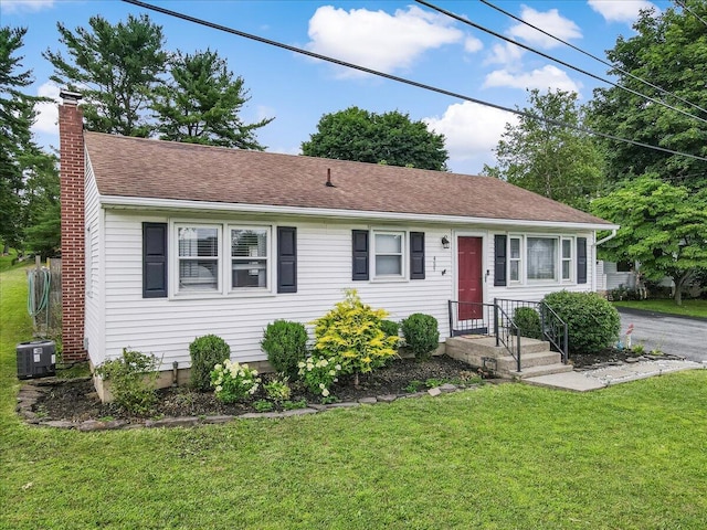 489 Sportsman Club Rd, Nazareth, PA 18064 - view of front of property featuring a chimney, a front yard, and roof with shingles