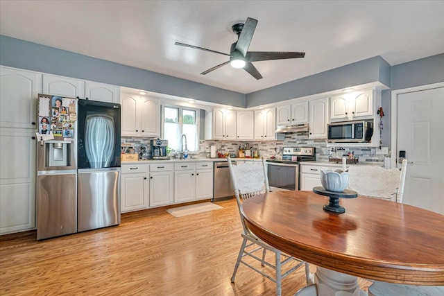 489 Sportsman Club Rd, Nazareth, PA 18064 - kitchen featuring appliances with stainless steel finishes, white cabinets, ceiling fan, and light countertops