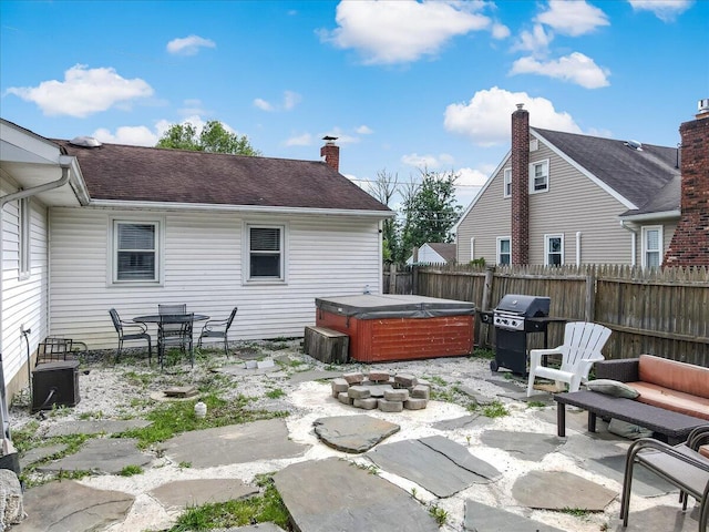 489 Sportsman Club Rd, Nazareth, PA 18064 - fenced backyard featuring a hot tub, a patio, and grilling area