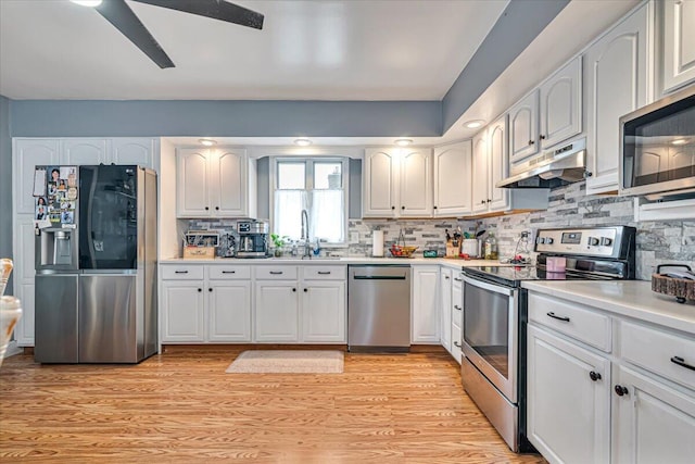489 Sportsman Club Rd, Nazareth, PA 18064 - kitchen with appliances with stainless steel finishes, under cabinet range hood, and white cabinets