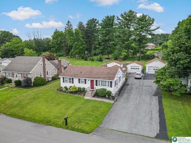 489 Sportsman Club Rd, Nazareth, PA 18064 - view of front of home with a detached garage, a front yard, an outbuilding, and asphalt driveway