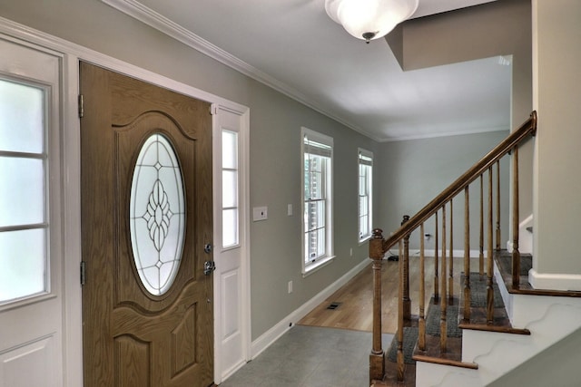 102 Crest Cir E, Stroudsburg, PA 18301 - foyer entrance with crown molding, stairs, plenty of natural light, and tile patterned flooring