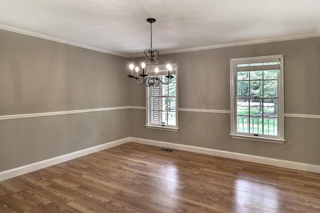 102 Crest Cir E, Stroudsburg, PA 18301 - unfurnished room with a chandelier, healthy amount of natural light, wood finished floors, and ornamental molding