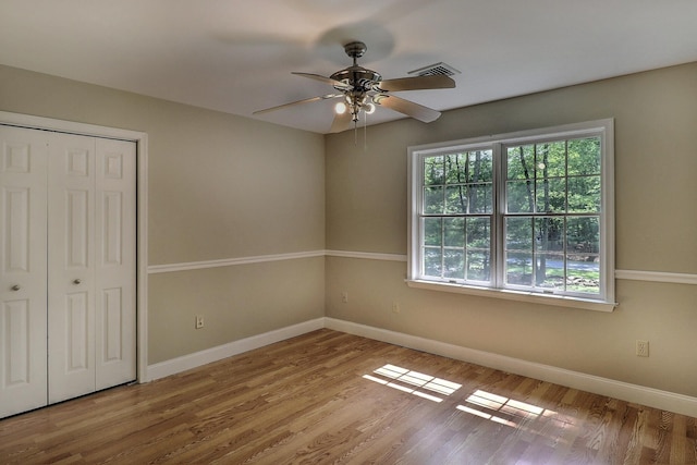 102 Crest Cir E, Stroudsburg, PA 18301 - unfurnished bedroom with wood finished floors, a closet, and a ceiling fan