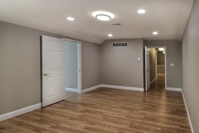 102 Crest Cir E, Stroudsburg, PA 18301 - spare room with wood finished floors, lofted ceiling, and recessed lighting