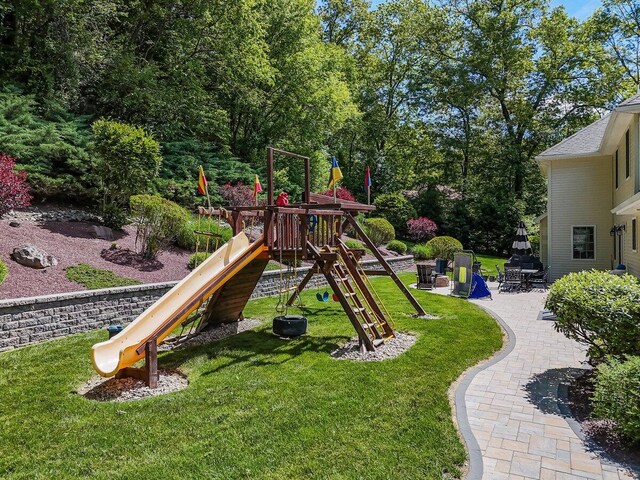 1376 Buck Ridge Dr, Stroudsburg, PA 18360 - view of playground featuring a lawn and a patio area