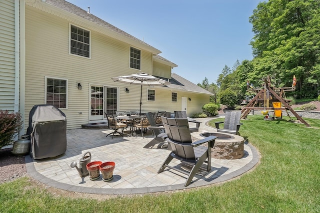 1376 Buck Ridge Dr, Stroudsburg, PA 18360 - view of patio / terrace featuring a fire pit, a grill, and a playground