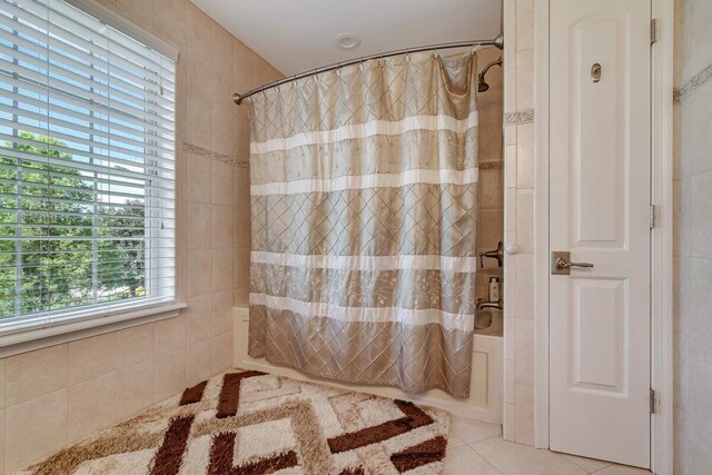 1376 Buck Ridge Dr, Stroudsburg, PA 18360 - bathroom featuring shower / bath combo with shower curtain and tile patterned floors