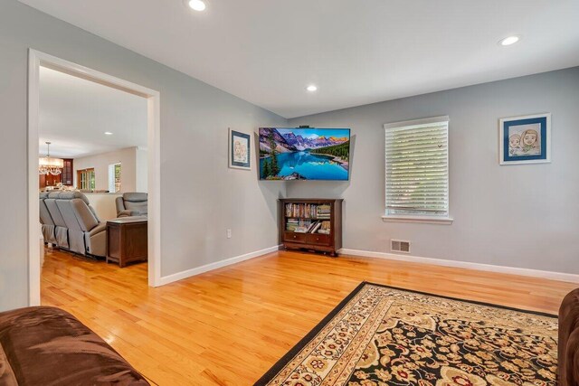 1376 Buck Ridge Dr, Stroudsburg, PA 18360 - hall featuring light wood-type flooring, a chandelier, recessed lighting, and baseboards