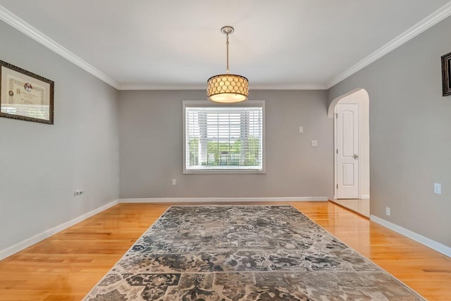 1376 Buck Ridge Dr, Stroudsburg, PA 18360 - unfurnished room featuring light wood-style flooring, arched walkways, ornamental molding, and baseboards