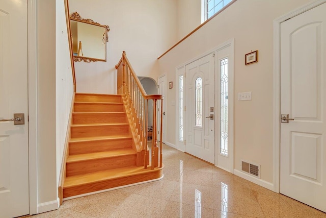 1376 Buck Ridge Dr, Stroudsburg, PA 18360 - entrance foyer featuring baseboards, stairway, a towering ceiling, and granite floors