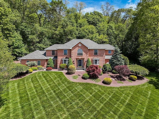 1376 Buck Ridge Dr, Stroudsburg, PA 18360 - colonial house with brick siding and a front lawn