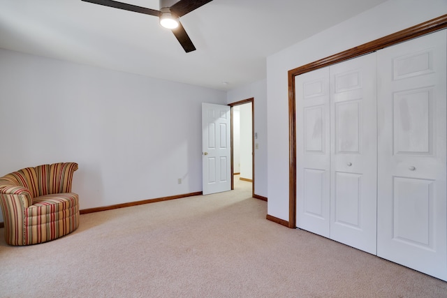 unfurnished room with light carpet, ceiling fan, and baseboards