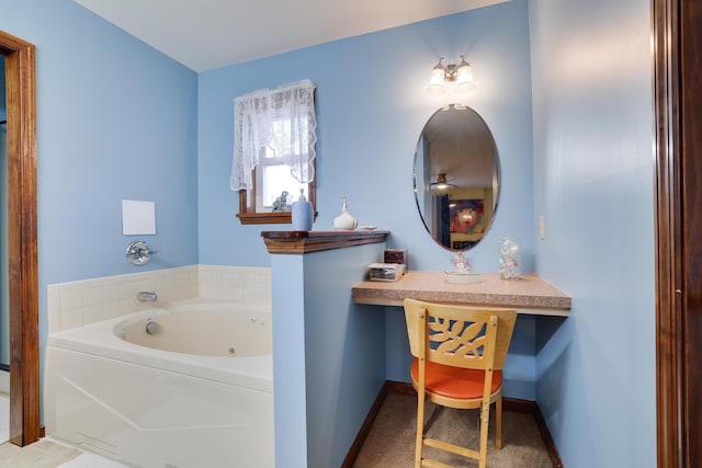 full bathroom featuring baseboards and a tub with jets