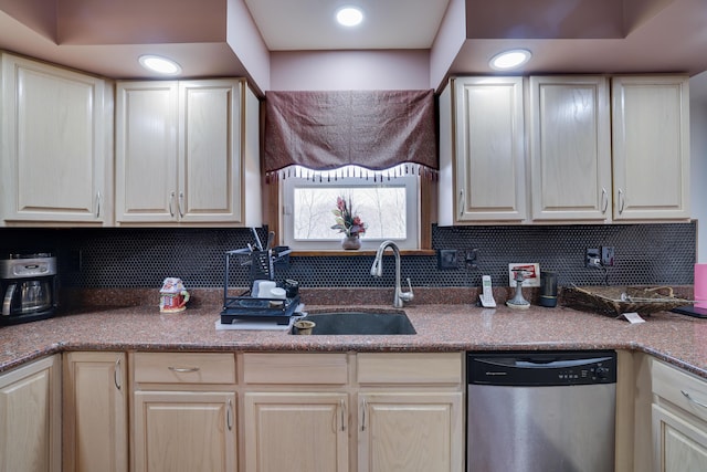 kitchen with stainless steel dishwasher, tasteful backsplash, and a sink