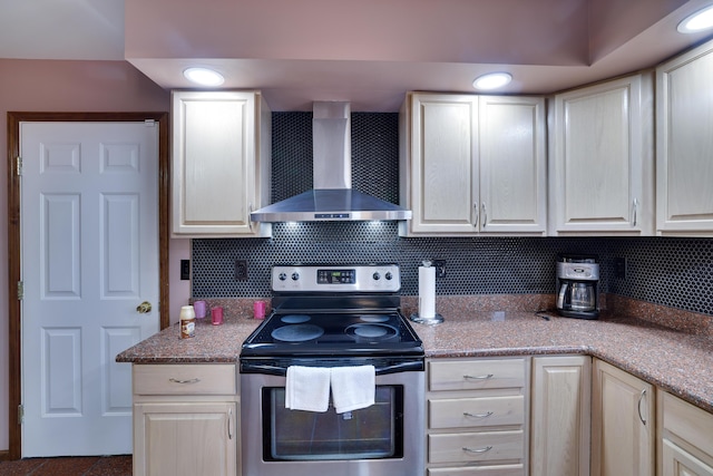 kitchen featuring backsplash, recessed lighting, stainless steel electric range, white cabinetry, and wall chimney exhaust hood