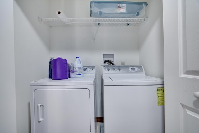 laundry room with washer and dryer and laundry area