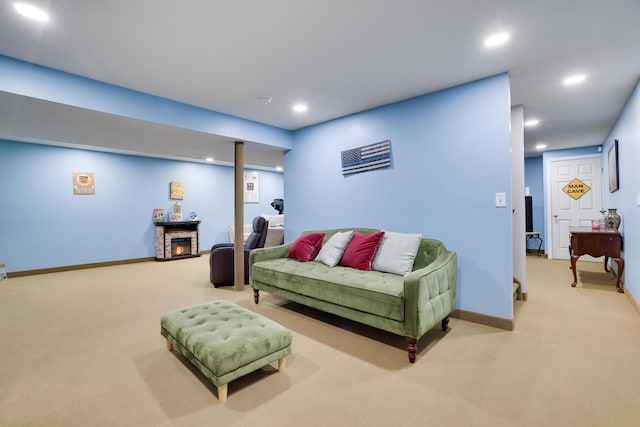 living area featuring carpet flooring, recessed lighting, a fireplace, and baseboards