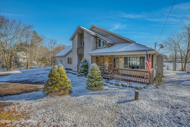 view of snowy exterior with a porch