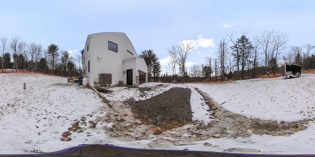 exterior space featuring a garage and cooling unit