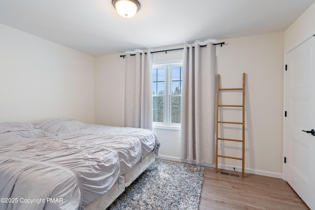 bedroom featuring light wood-type flooring