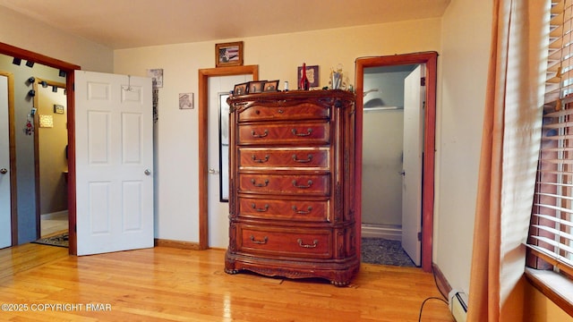 619 Rimrock Rd, Bartonsville, PA 18321 - bedroom featuring baseboard heating and light wood-style floors
